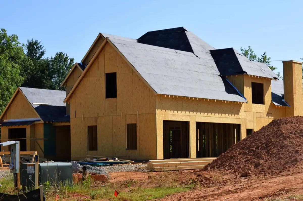 House with new roof decking and synthetic underlayment during a roof replacement in Kansas City, MO