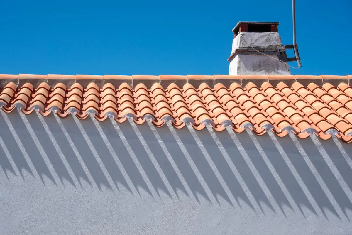 Roof ridge line and chimney on a home in Kansas City, MO