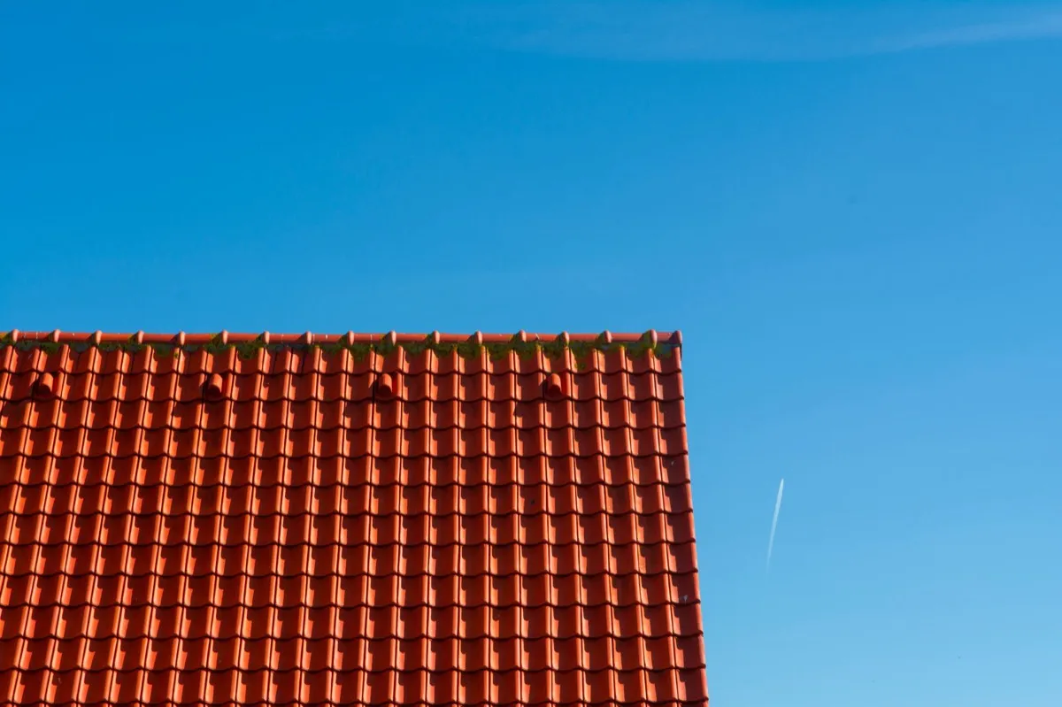 Tile roof gable in full sun, the kind of exposure that sets roof life in Kansas City, MO